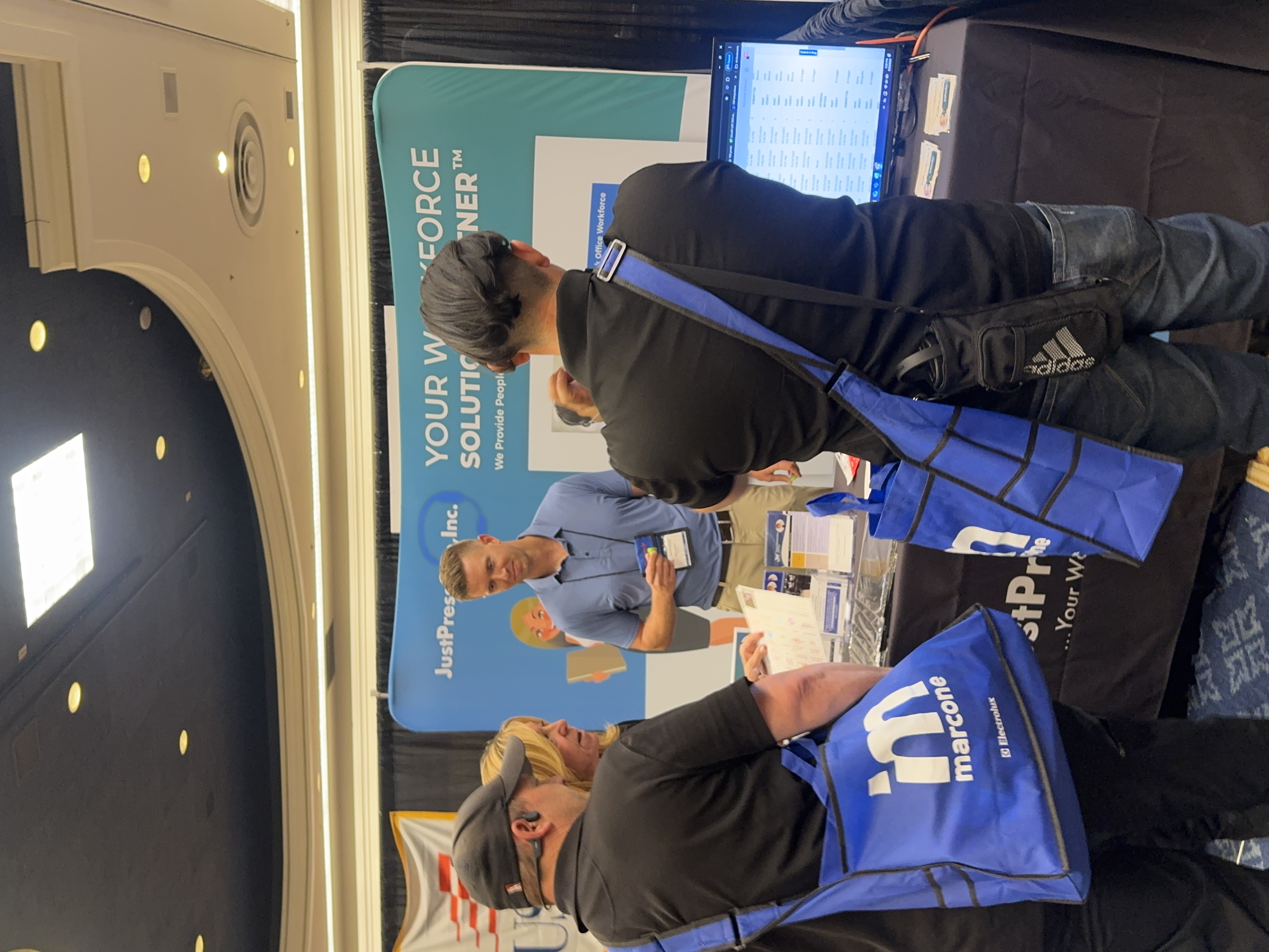 Commercial service team at trade show booth